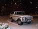 1979 Ford Bronco - A white 1978 Ford Bronco is seen parked in the snow at night.