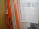 2003 Mazda Protege - A handwritten note with vehicle information is attached to an orange and white striped object.