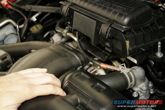 mac10.jpg The air inlet tube simply pulls out of the air box. On the body end it's held in with a simple rubber grommet. Remove the whole tube and grommet and set them aside.