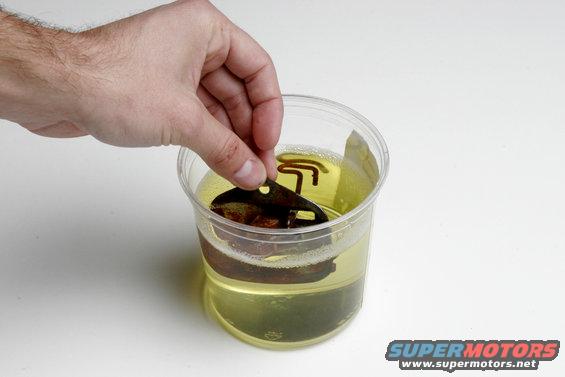 orison02.jpg All we did to prepare the choke for cleaning was spray it off with a degreaser to make sure the Evapo-Rust could get to every surface. We filled a small plastic tub with Evapo-Rust and dropped in the actuator.