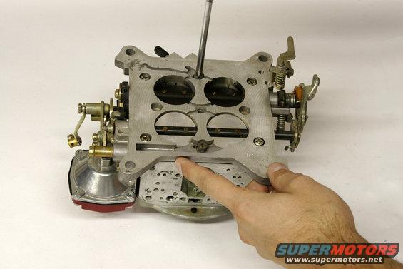 qft10.jpg An old throttle body gasket can cause vacuum leaks and tuning problems. To replace it, remove the throttle body, which is secured by these six screws.