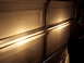 1995 Ford Probe - The headlights of a vehicle are illuminated in front of a closed garage door.