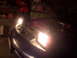 1995 Ford Probe - A car's headlight is on, illuminating the engine bay and front fender area.