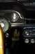 1968 Ford Mustang - The interior of a 1968 Ford Mustang shows the dashboard with its characteristic gauges and radio.