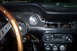 1968 Ford Mustang - The interior of a classic Mustang shows its dashboard gauges and radio, indicating it is a 1968 model.