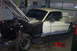 1968 Ford Mustang - This 1968 Ford Mustang coupe is in a garage, undergoing restoration with its hood open and front fender removed.