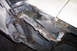1968 Ford Mustang - The door jamb of a 1968 Ford Mustang shows significant rust and evidence of repair work.