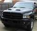 2002 Dodge 2500 - Front view of a black Dodge Ram pickup truck with aftermarket modifications.