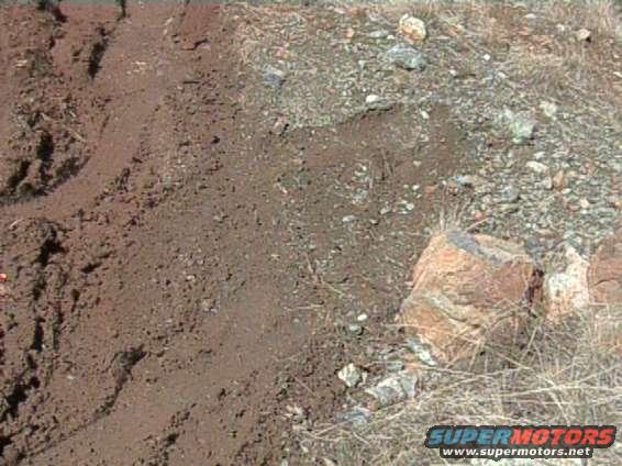 Went up the hill and got a little side ways. See how close the tracks came to that dang rock. Dont know what I would have done if I would have slid into them. Could have gotten interesting.