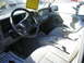 1998 Chevrolet Tahoe - The interior of a Chevrolet or GMC pickup truck or SUV from the mid-1990s is visible, including the dashboard and seats.