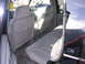 1998 Chevrolet Tahoe - Interior view of a black SUV, showing the rear seats and an 'LS' badge on the door.