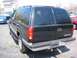 1998 Chevrolet Tahoe - Rear view of a black 1998 Chevrolet Tahoe parked at a dealership.