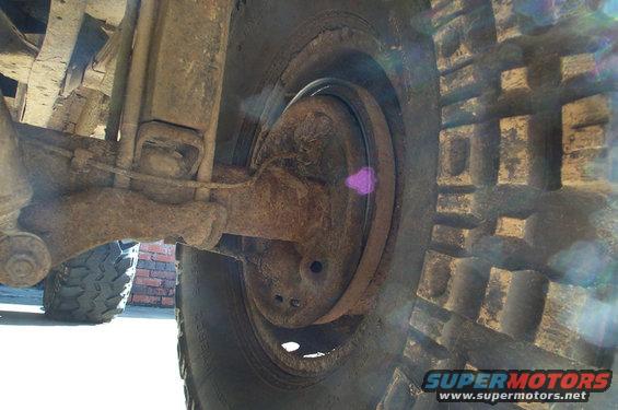 Truck rear suspension and tire with Supermotors.net logo