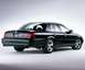 2003 Mercury Marauder - A black 2003 Mercury Marauder is shown from the rear 3/4 angle against a light gray background.