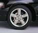 2003 Mercury Marauder - Close-up of the front wheel and fender of a black 2003 Mercury Marauder.