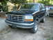 1992 Ford Bronco - This 1992 Ford Bronco is shown in a front 3/4 view, its distinctive chrome grille and black paint.