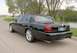 2003 Mercury Marauder - Black 2003 Mercury Marauder seen from the rear quarter angle on a road.
