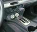 2003 Mercury Marauder - The interior of a car is visible, focusing on the center console with the gear shifter and auxiliary gauges.