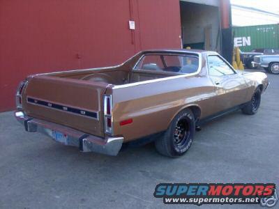Brown 1972 Ford Ranchero parked outside a building, rear view