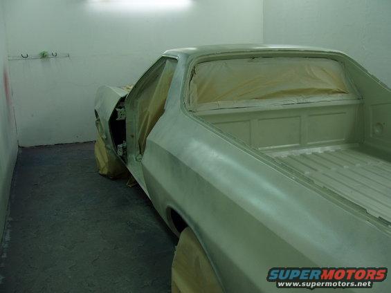 1972 Ford Ranchero in paint booth, primer finish, driver's door open