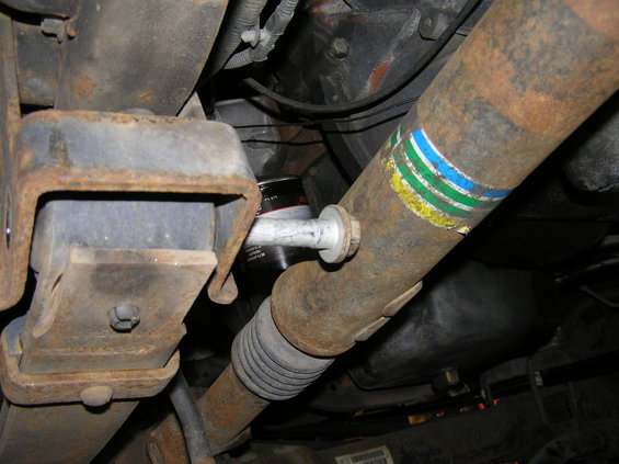 p1200090.jpg I also wanted to show this bolt from the driver's side angle as well. You may run into the issue where the front driveshaft interferes with the bolt. Simply jack the floor jack up to create enough room for the bolt to clear the top of the driveshaft.