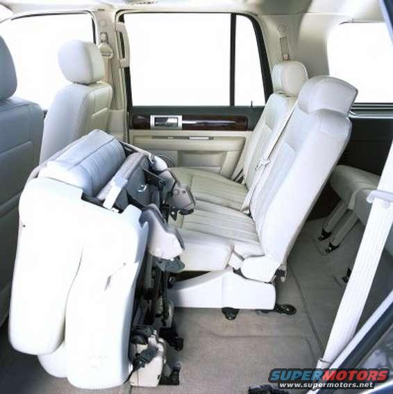 Folded car seat in the back of a vehicle