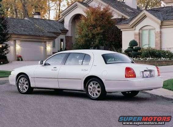 White 2003 Lincoln Town Car, rear view