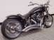 1995 Harley-Davidson Fat Boy - This custom black motorcycle features "IRONBIKE" branding on its fuel tank and a distinctive wide rear tire.