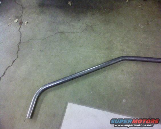 Bent metal pipe on concrete floor