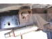 1978 Ford Bronco - Underside view of vehicle frame components, including a body mount and exhaust system.