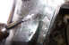 1968 Ford Mustang - A close-up view of a vehicle's metal panel, possibly undergoing repair or restoration work.