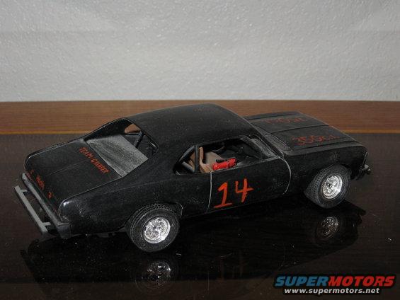 Black model car with red number 14 on the side and 'TEAM CRUISER' on the trunk
