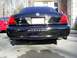 2003 Mercury Marauder - Rear view of a black 2003 Mercury Marauder sedan, showing its distinctive taillights and dual exhaust.