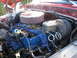 1979 Ford Bronco - Close-up view of a vehicle's engine compartment, showing the carburetor and brake booster.