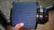 1989 Ford Probe - A blue cone air filter is shown, likely an aftermarket part for a vehicle.