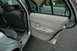 2003 Ford Crown Victoria - Interior view of a 2003 Ford Crown Victoria with both front and rear doors open.