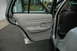 2003 Ford Crown Victoria - Interior view of a 2003 Ford Crown Victoria, showing the rear door panel and seat.