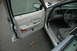 2003 Ford Crown Victoria - The interior of a 2003 Ford Crown Victoria is shown with the driver's side door open.
