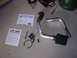 1996 Ford Probe - Parts for a K&N performance intake system are laid out on a concrete floor with installation instructions.