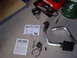 1996 Ford Probe - Parts for a cold air intake system, including tubing, filter, and instructions, are arranged on the floor.