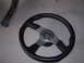 1996 Ford Probe - A Momo steering wheel and a section of exhaust pipe are shown, neither of which are identifiable as a 1996 Ford Probe.