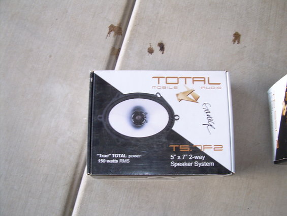 Speaker box with "TOTAL MOBILE AUDIO" and "TS.OF2 5" x 7" 2-way Speaker System" text