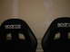 1996 Ford Probe - Two black Sparco racing seats are shown, each with a white logo embroidered on the headrest.