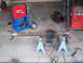 1991 Ford Bronco - Dana 44 axle assembly from a Ford Bronco, ready for work with a welder nearby.