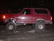 1991 Ford Bronco - This lifted 1991 Ford Bronco is shown from the side, large off-road tires.