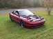 1995 Ford Probe - Red 1995 Ford Probe with its hood open, showing the engine bay.