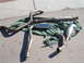 1996 Ford Probe - Exhaust system components, including mufflers and pipes, are displayed on a green tarp.