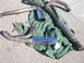 1996 Ford Probe - Several exhaust system components, including mufflers and chrome tips, are displayed on a piece of green fabric on the ground.