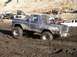 1978 Ford Bronco - Muddy 1978 Ford Bronco navigating difficult terrain.