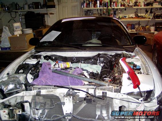 1993 Ford Probe engine bay during ZE swap, front end disassembled